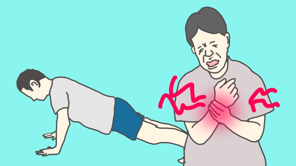 腕立て伏せで手首が痛くなって、顔をしかめている男性